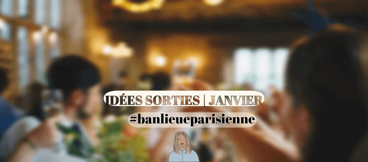 Des personnes trinquant avec des verres dans un restaurant à l'ambiance chaleureuse et tamisée.