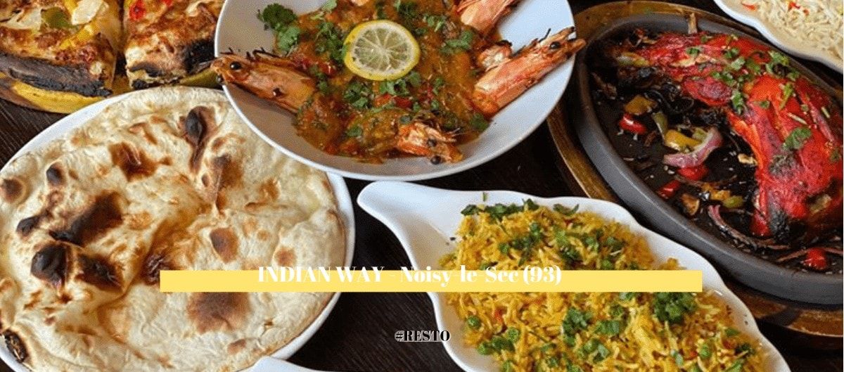 Assortiment de plats indiens : naan, curry de gambas, poisson tandoori et riz au restaurant Indian Way